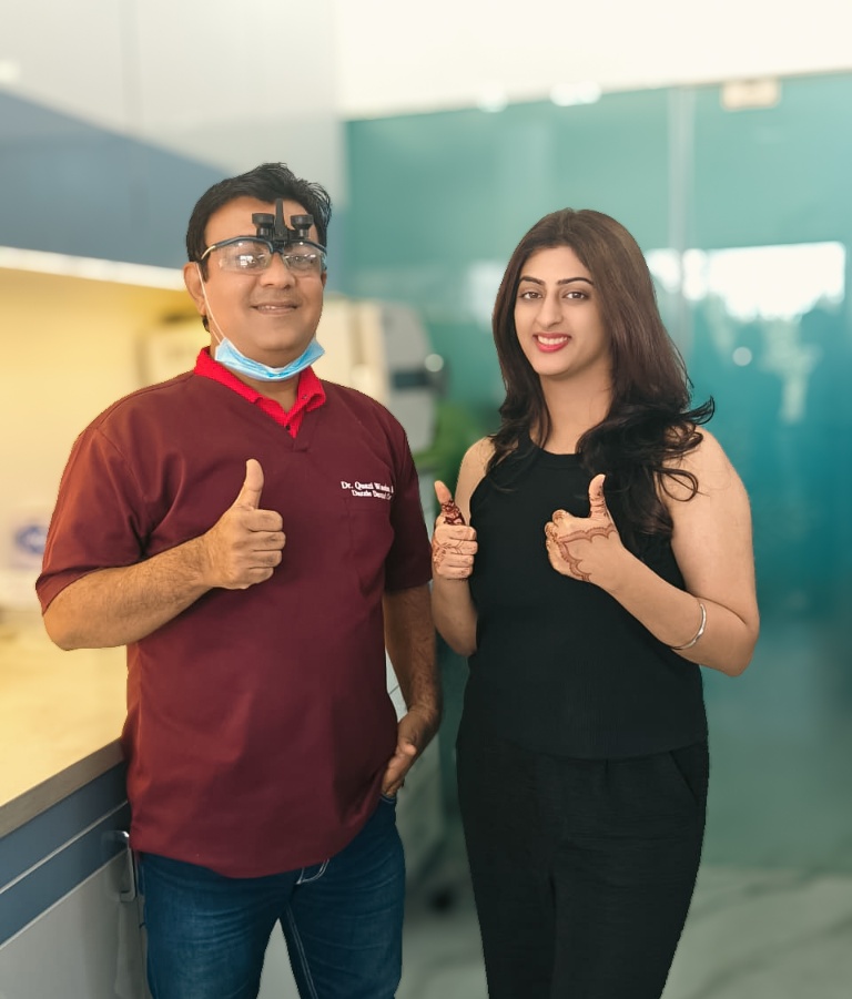 Dr. Quazi Wasim Bari with happy patient at Dazzle Dental Care